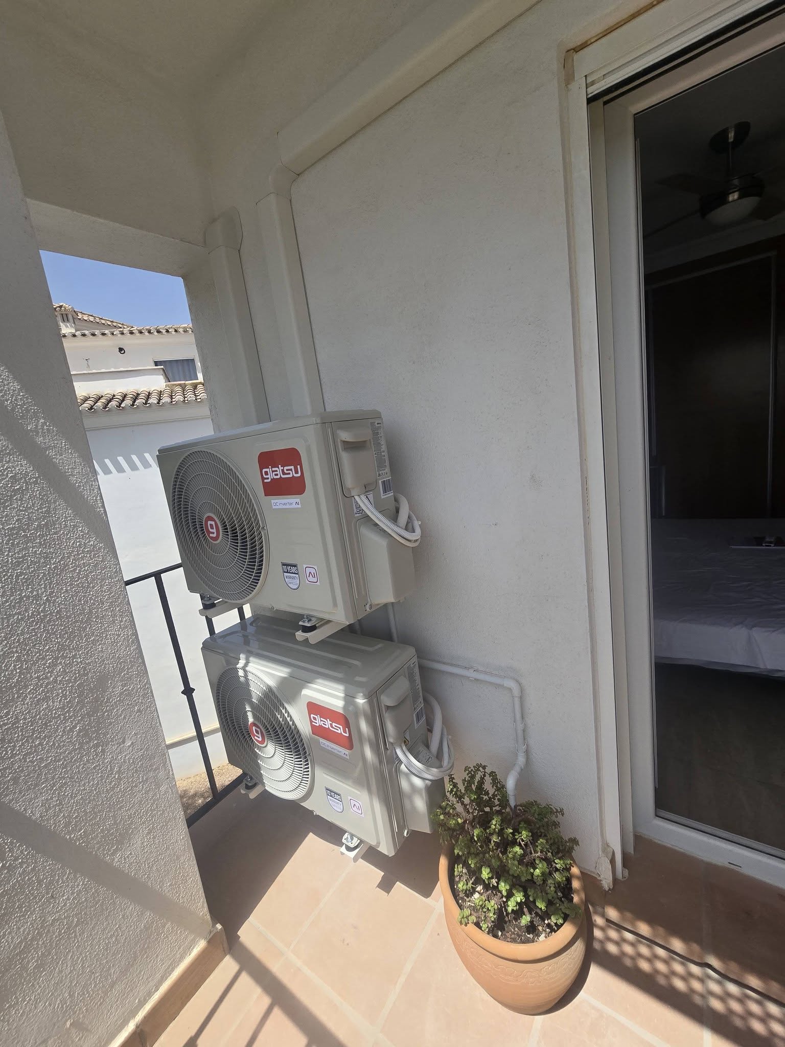 Neatly enclosed air conditioning pipework around a Costa Blanca property terrace