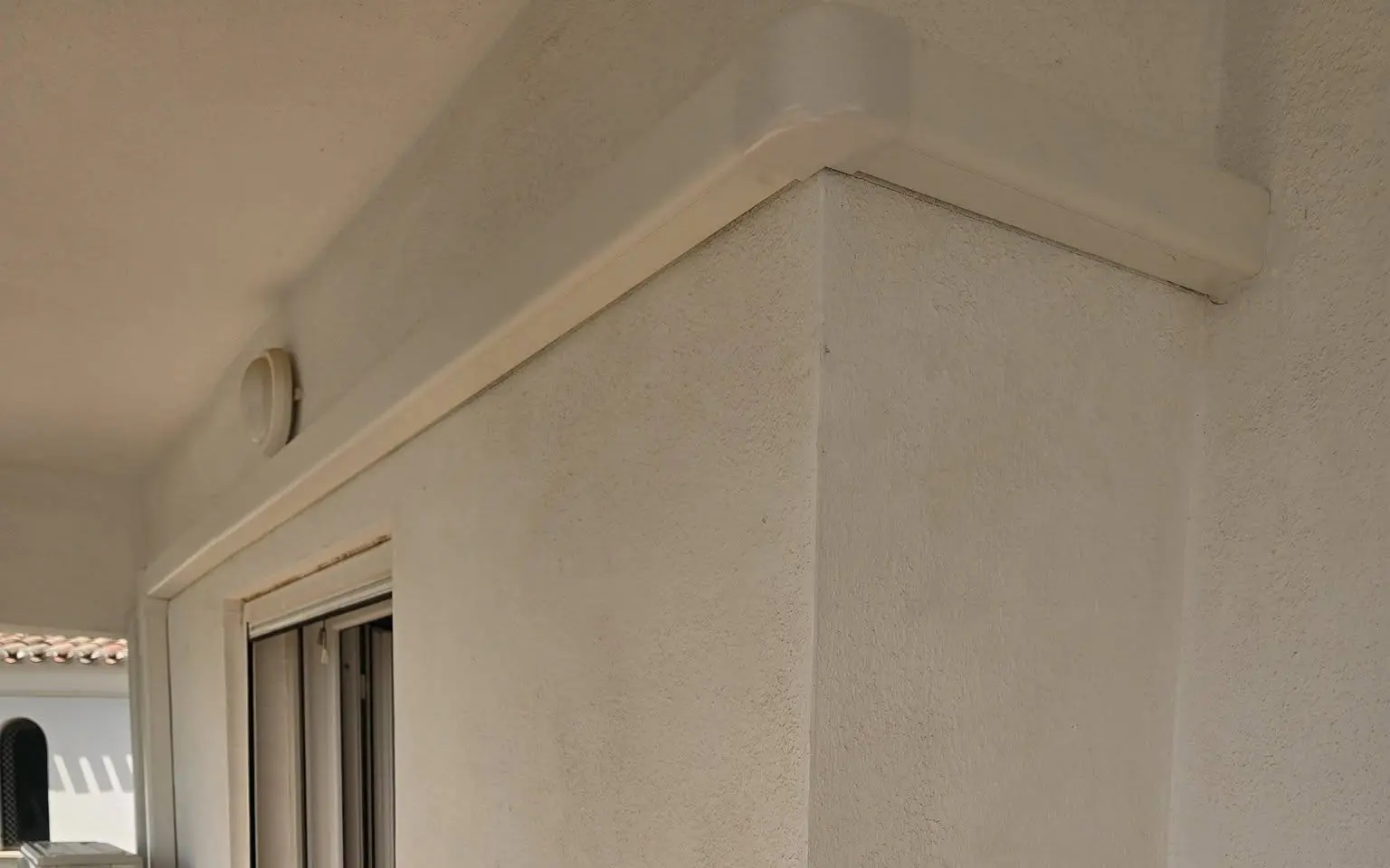 Neatly enclosed air conditioning pipework around a Costa Blanca property terrace
